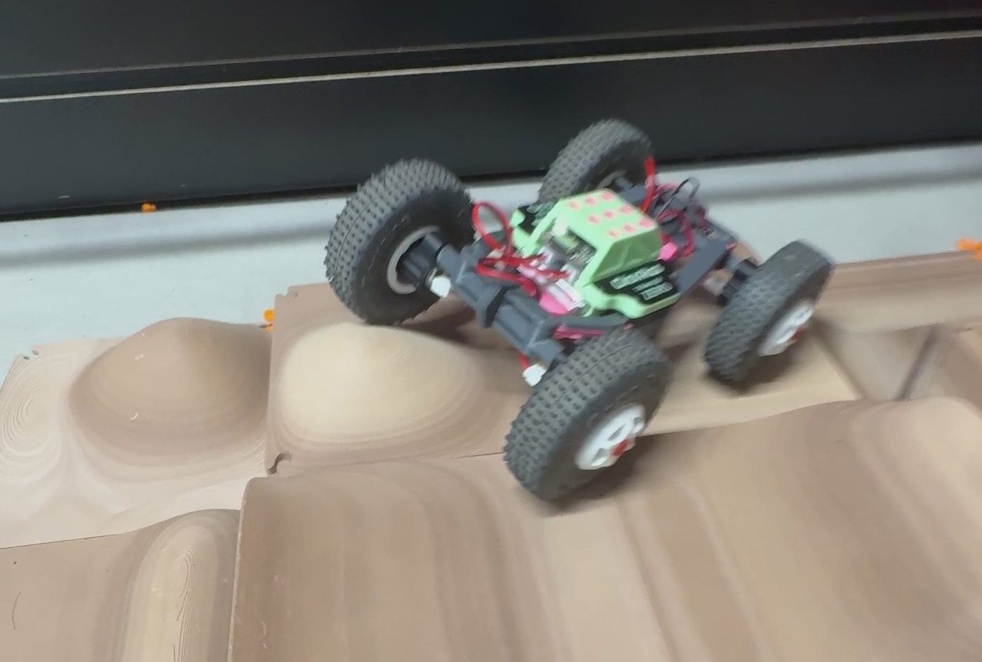 A printed ClickRigs truck on a printed terrain
